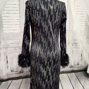 Black knit and silver sequin dress with feather cuffs