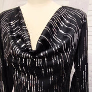 Black knit and silver sequin dress with feather cuffs