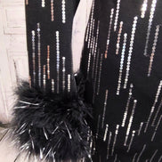 Black knit and silver sequin dress with feather cuffs
